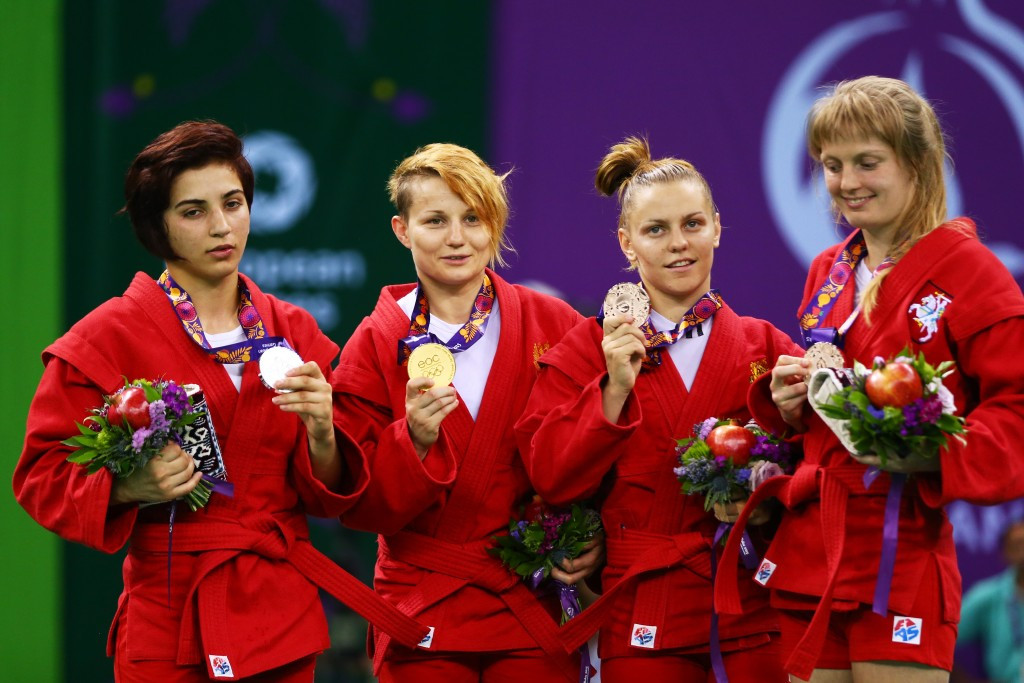 Anna Kharitonova (centre, left) won the first of Russia's five sambo gold medals ©Getty Images 