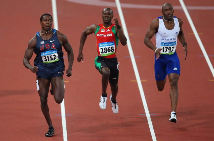 Kim Collins (centre), racing at his fourth Olympics at Beiiing 2008, is hoping to be back for Rio 2016 after being excluded from London 2012 following a row with the St Kitts and Nevis Olympic Committee ©Getty Images